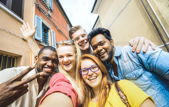 Best friends multiracial people taking selfie outdoors - Stock Photo - Images