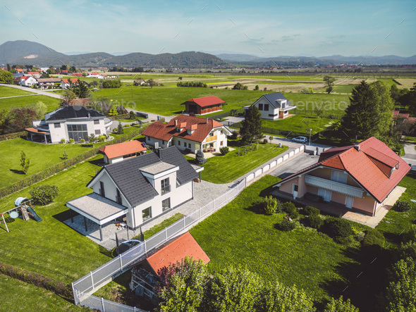 Aerial view of modern houses, family homes in the countryside with big backyards