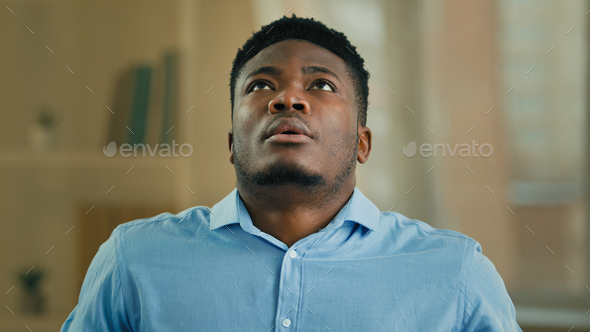Disappointed upset desperate man african businessman office worker employee has business problem bad