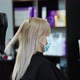 Hands of a hairdresser in rubber hair blow dry a blonde. - VideoHive Item for Sale