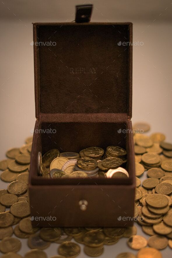 Closeup of Euros and cents in a wooden box - Stock Photo - Images