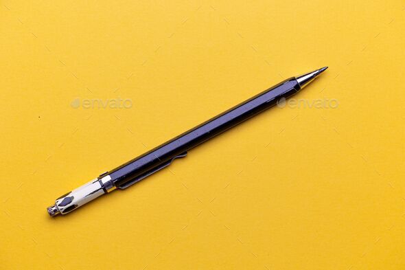 Pencil with yellow background. Pencil with removable graphite tip. Drawing pencil