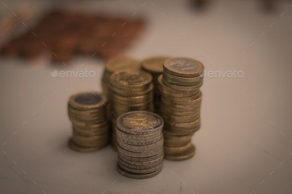 Closeup of Euros and cents stacked on a table - Stock Photo - Images