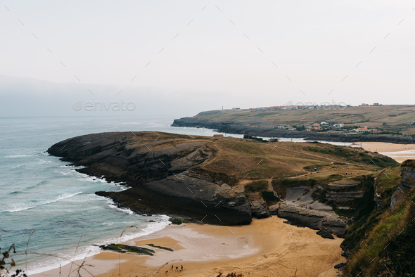 Antuerta Beach. Beach surrounded by cliffs and very popular for surfers - Stock Photo - Images