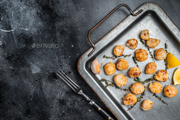 Scallops Poached In A Butter And Garlic Sauce In A Steel Tray With Thyme Black Background 5028