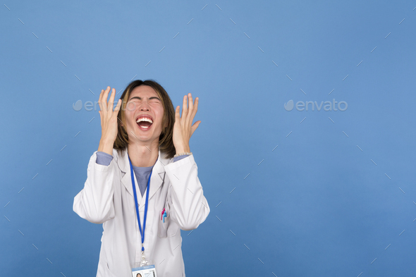 Portrait of a Celebrating and Joyful Young Chinese Scientist in Lab Coat
