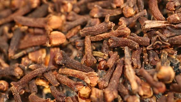 Pile of Flavorful Dried Cloves, Aromatic Additive to Dishes and Hot Beverages alt