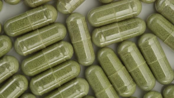 superfoods moringa capsules top view. Spirulina, chlorella capsules alt