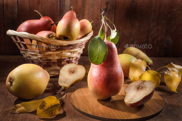 Ripe pear and a bunch of viburnum berries - Stock Photo - Images