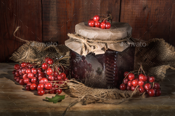 Berries and a jar of jam - Stock Photo - Images