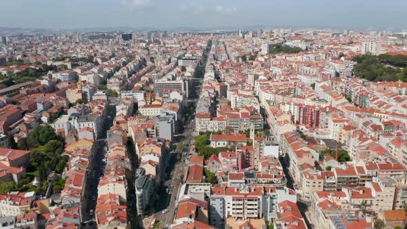 Wide Aerial Panoramic View of Colorful Houses with Orange Rooftops in Urban City Center of Lisbon alt