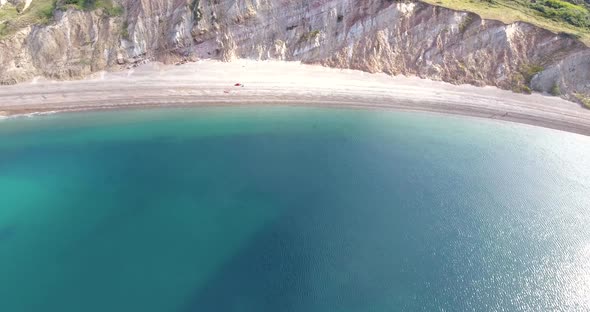 Secluded Beach Surrounded by Cliffs