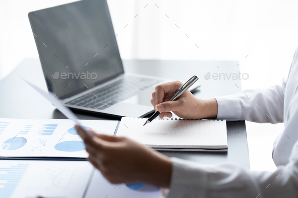 Businessman Accounting Calculating Cost Economic Financial data.