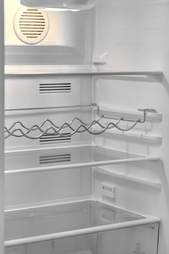 Open Door Of A Modern Refrigerator With Empty Shelves And Bottle Rack   Wgqy8WHaQclCH5UZ5Ev7O8zyle9PijJF3esJE9mJ 