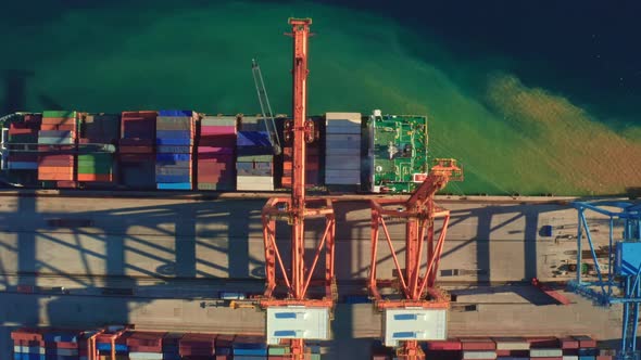 Portal Crane Loads Big Containers on Ship for Transportation alt
