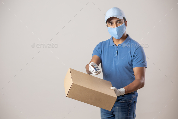 Delivery man in gloves delivering cash and payment terminal Stock