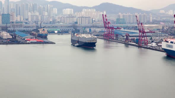 Timelapse Cargo Ship Departs Incheon Harbour Against City alt