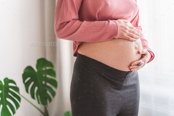 Pregnant Woman Standing And Touching With Her Hands Her Big Naked Belly A Hypnobirthing 