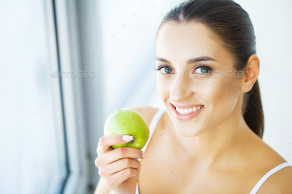 Woman Eating Apple. Beautiful Girl With White Teeth Biting Apple. High ...