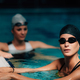 Young Women Resting, Poolside, Indoor Pool. Recreational Swimming. - PhotoDune Item for Sale