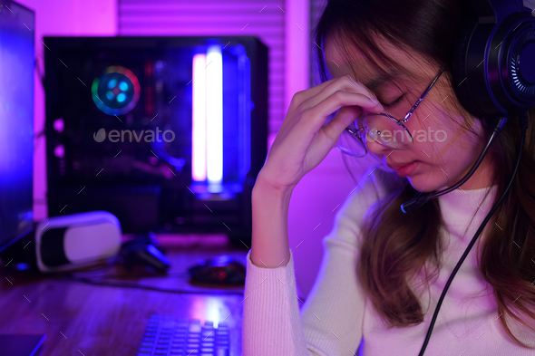Female gamer having eye strain and headache after lose game