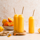 Smoothie. Healthy fresh raw detox citrus smoothie with orange, lemon, ginger and turmeric in a glass - PhotoDune Item for Sale