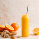 Smoothie. Healthy fresh raw detox citrus smoothie with orange, lemon, ginger and turmeric in a glass - PhotoDune Item for Sale