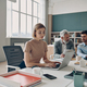 Group of confident business people working together while sitting at the shared desk in the office - PhotoDune Item for Sale