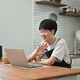 Cheerful young man freelancer checking email in morning, working online on laptop . - PhotoDune Item for Sale