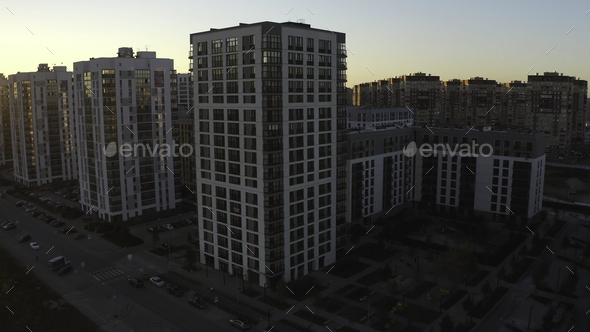Top view of modern residential complex with sunlight. Stock footage. Beautiful red rays of sun fall - Stock Photo - Images