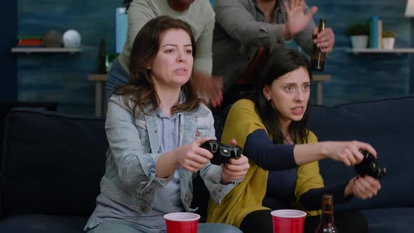 Upset Gamers Losing Online Videogame Competition Using Gaming Joystick alt