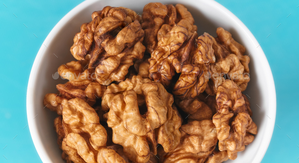 Close up picture of organic walnuts in a bowl, selective focus. - Stock Photo - Images