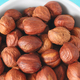 Close up picture of organic hazelnuts in a bowl, selective focus. - PhotoDune Item for Sale