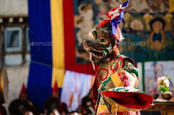 Tibetan Buddhist dancer in traditional demon spirit ghost clothing doing the ritual dance
