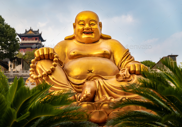 Big gold sculpture of a Laughing Buddha at Temple in China Stock Photo ...