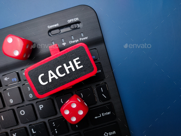 Keyboard and red dice with the word CACHE. Business concept - Stock Photo - Images