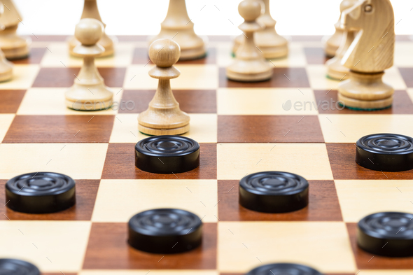 chess and checkers gaming on board closeup - Stock Photo - Images