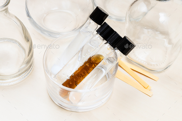 test tubes, bottles and indicator papers on desk