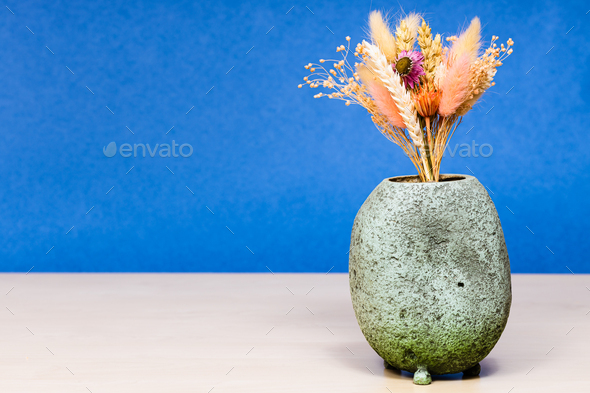 vase with bouquet of dried flowers on table - Stock Photo - Images