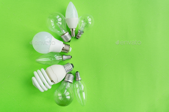 A set of different types of LED lamps isolated on a green background. Energy-saving lamps.
