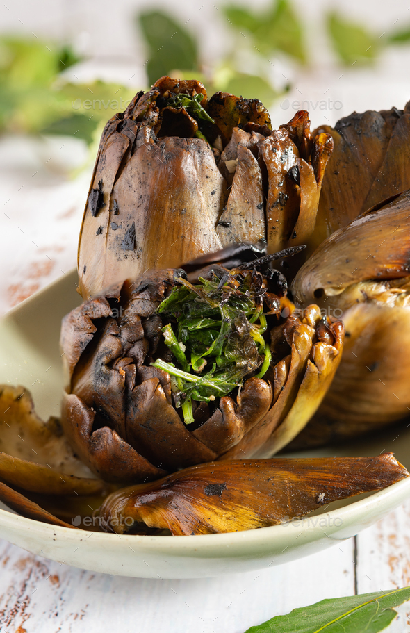 Grilled artichokes seasoned with olive oil - Stock Photo - Images