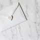 Minimalistic mockup friendly white envelope with pastel heart sealing it on marble surface   - PhotoDune Item for Sale