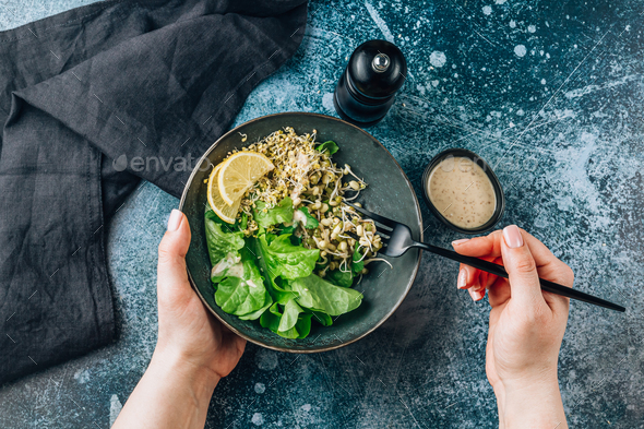 bowl with mixed salad of lettuce, sprouted grains and microgreens - Stock Photo - Images