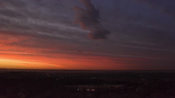 Aerial drone hyperlapse view of a pink and orange sunrise