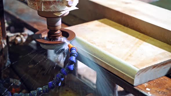 Grinder cutting marble. Detail of a circular saw used to cut granite alt