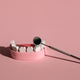 Jaw model and dental mirror on pink background. Dentist and Oral Hygiene Day. - PhotoDune Item for Sale
