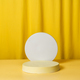 Round podium, pedestal on a bright yellow curtain background - PhotoDune Item for Sale