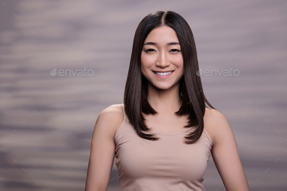 590px x 393px - Asian woman wearing beige top and nude makeup portrait Stock Photo by  DC_Studio