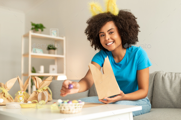 Happy Black Lady Celebrating Easter At Home, Making Holiday Gifts Packaging