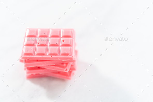 Mini pink chocolates Stock Photo by arina-habich